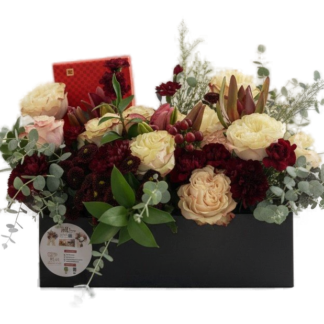 Rectangular flower box with blush garden roses, burgundy dahlias, and protea