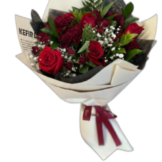Red rose bouquet with baby's breath wrapped in black paper with red ribbon