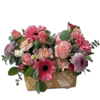 Soft pink rose and mixed flower bouquet wrapped in blush paper