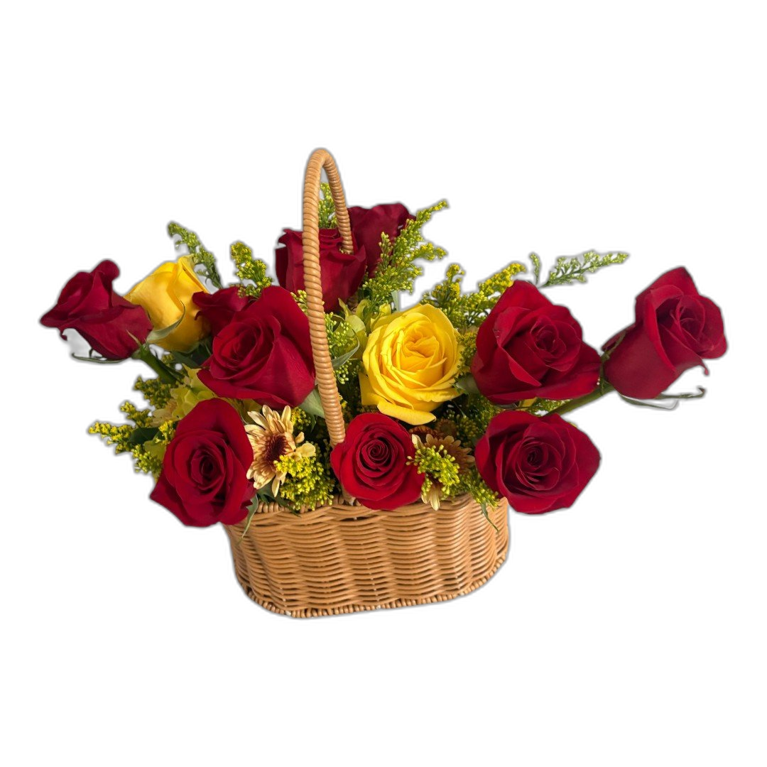 Red and yellow rose arrangement in a wicker handle basket