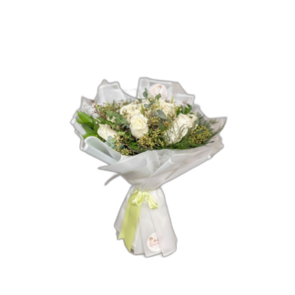 Pastel pink and cream rose bouquet with soft wrapping
