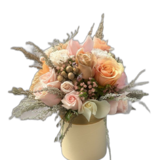 Peach and cream rose arrangement in a round cream gift box